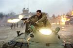 James Bond fights the enemy from atop a speeding Hovercraft