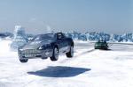 Bond's ASTON MARTIN V12 VANQUISH gets a jump on Zao's JAGUAR XKR